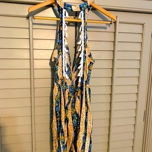 Fun shorts romper with tassel details. Size L.